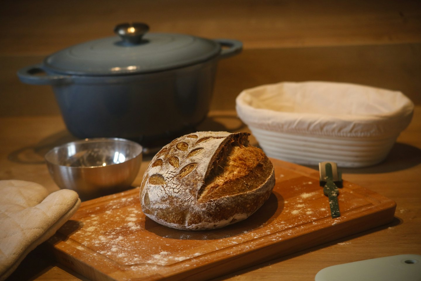 Artisanal sourdough bread on a wooden cutting board.